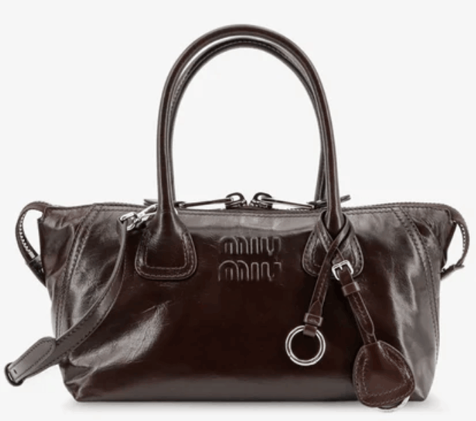 Leather handbag with embossed lettering logo